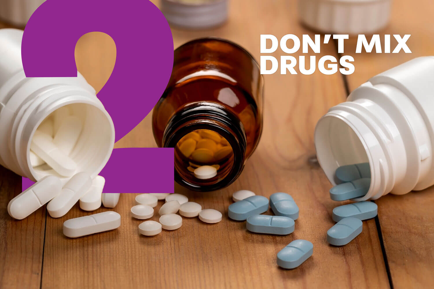Medicine bottles open and on their side with pills spilling out