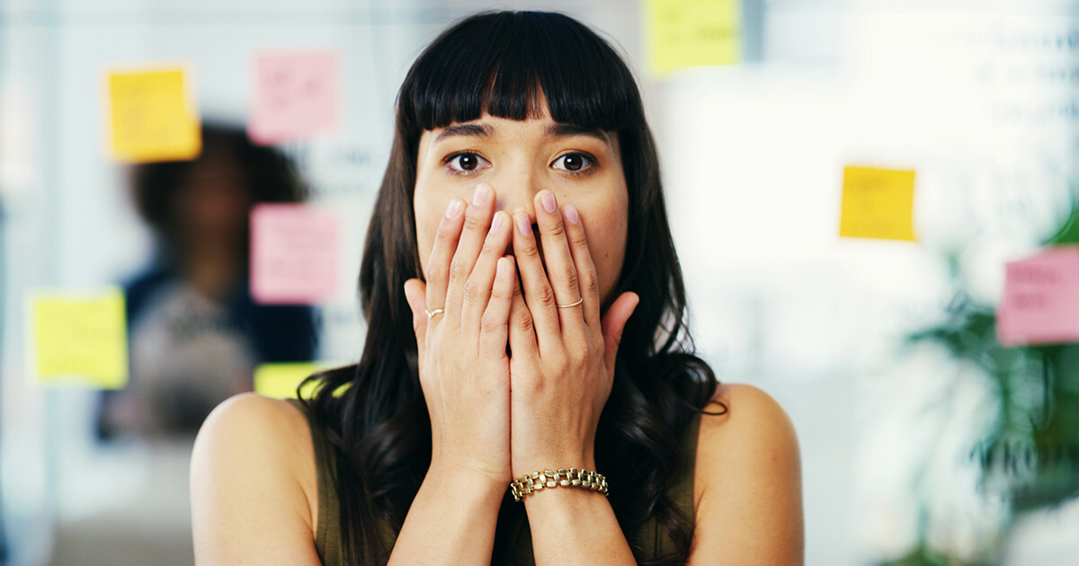Woman, portrait or shocked in office for project, creative opportunity or agenda update. Designer, what or sticky notes in agency for forgot reminder, calendar mistake or surprised for missed meeting
