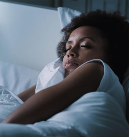 Person sleeping in bed