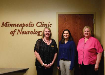 Dr. Sarah Benish with two office staff members at Minneapolis Clinic of Neurology