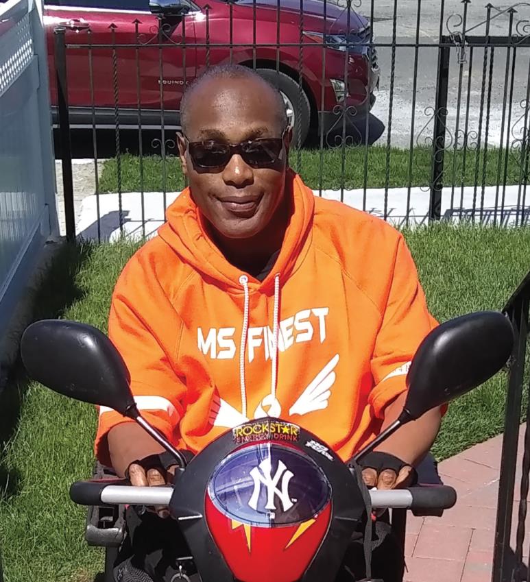 Patrick Prevost using a mobility scooter