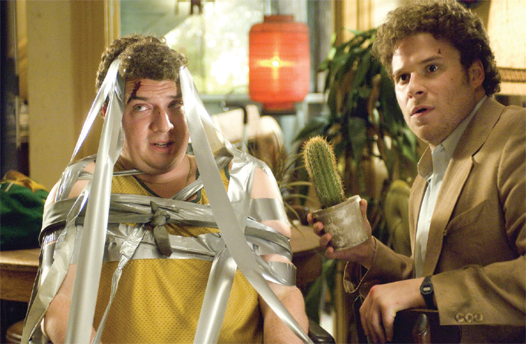 A film still of Joe Rogan with Danny McBride in Pineapple Express
