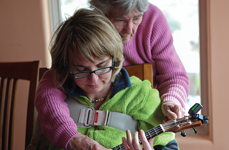 Giffords mother helping her relearn an instrument.