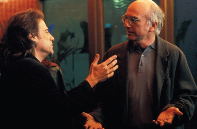A still image of Larry David and Lewis having a discussion on HBO's Curb Your Enthusiasm. 