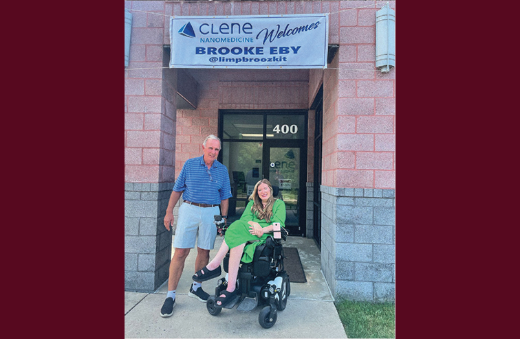 Brooke Eby with her dad outside the Clene Nanomedicine building in Maryland