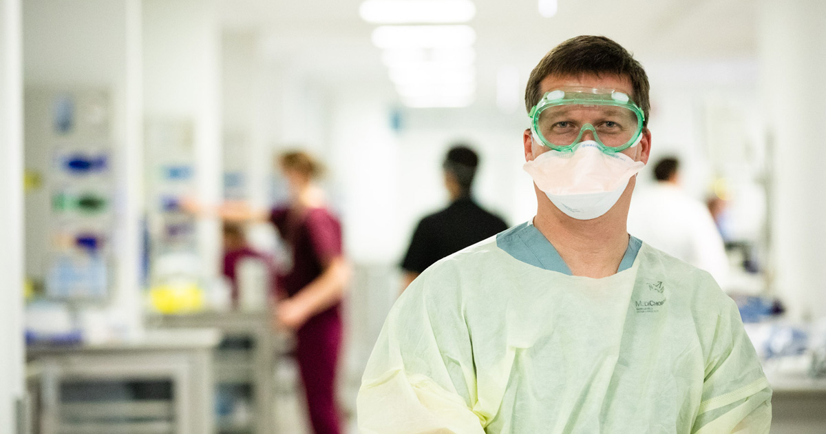 Neurologist wearing PPE in a hospital