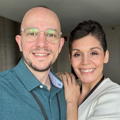Chris and Tiffany Kairos standing next to each other smiling for a selfie 