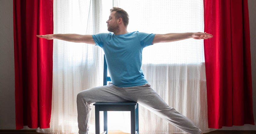Man doing chair yoga